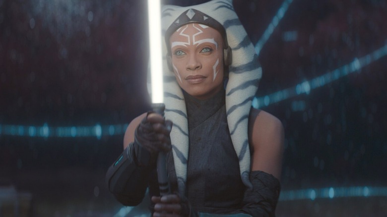 Ahsoka Tano holding one of her lightsabers in the World Between Worlds in Star Wars: Ahsoka