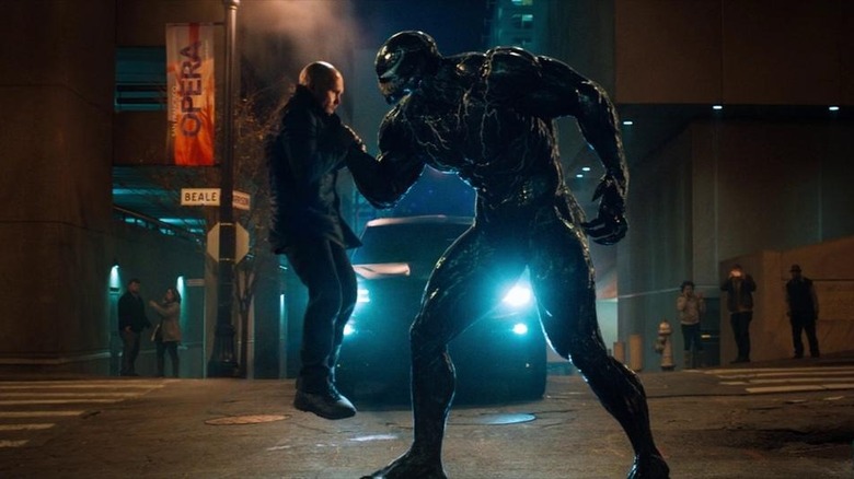 Venom grabs bad guy