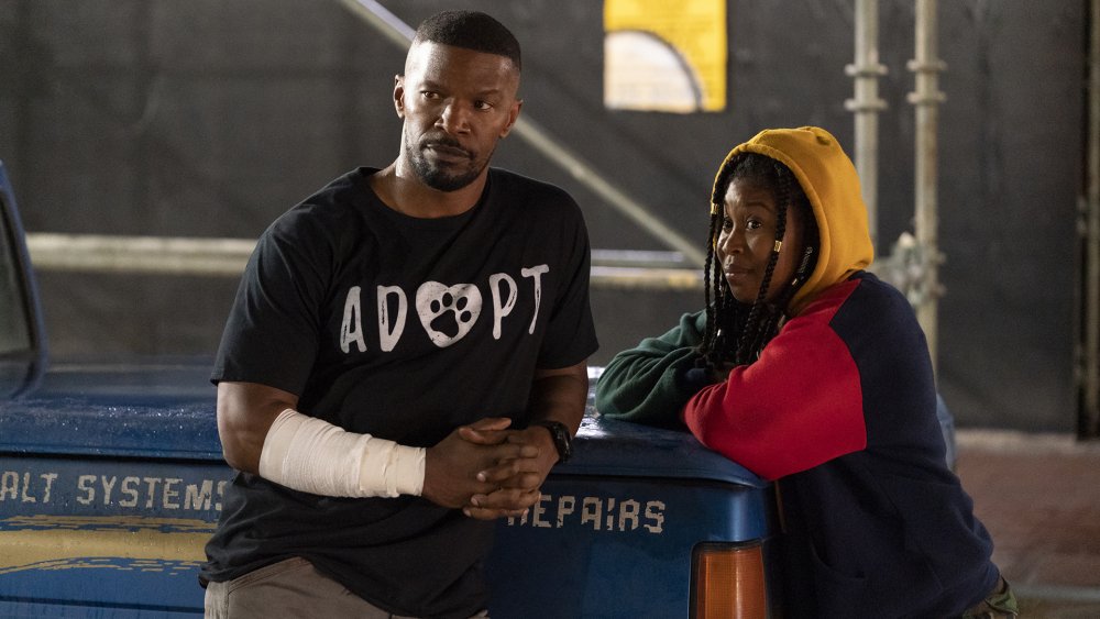 Jamie Foxx as Art and Dominique Fishback as Robin in Project Power