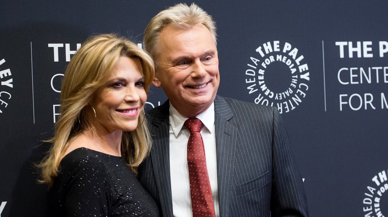 Vanna White and Pat Sajak smiling