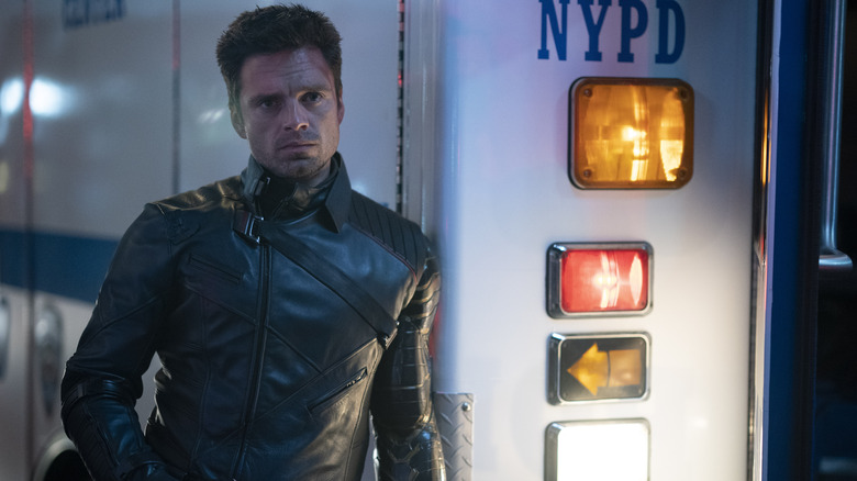 Bucky leaning against ambulance