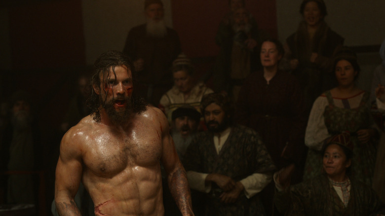 Shirtless Harald with onlookers in Vikings: Valhalla