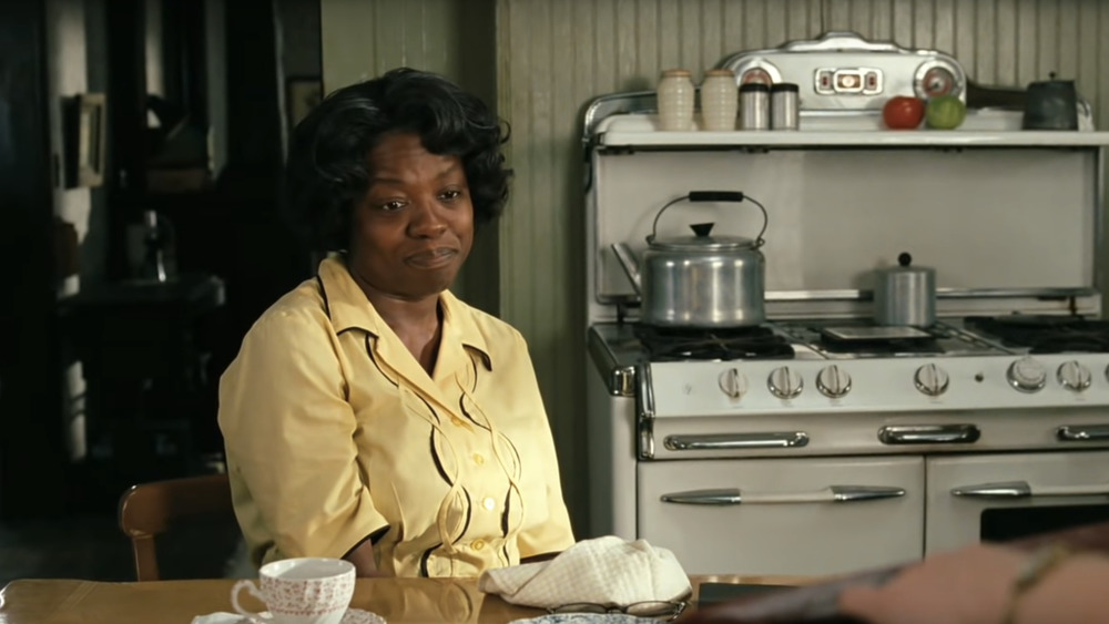 Viola Davis sitting at table