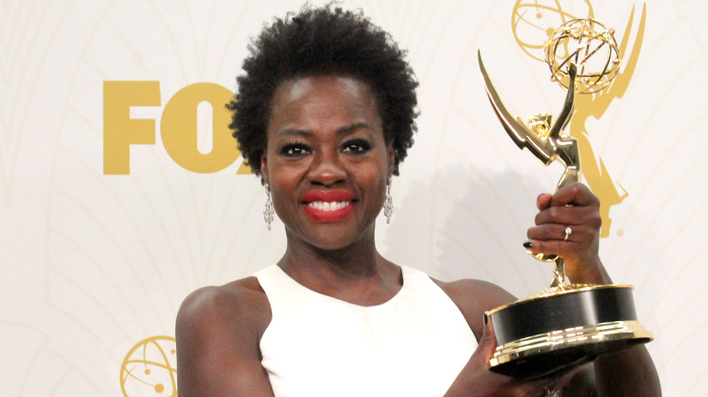 Viola Davis holding Emmy award and smiling