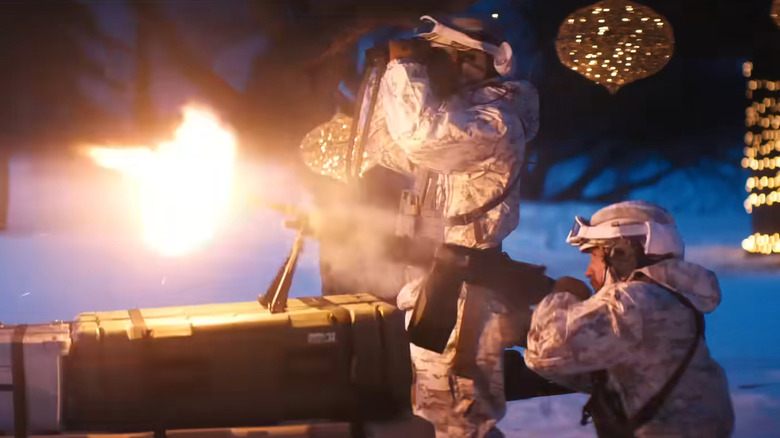 Soldiers fire a big gun