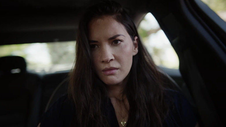 Olivia Munn upset in car