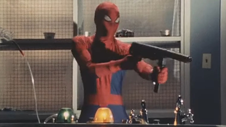 Spider-Man holding gun