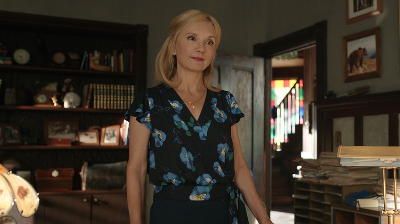 Muriel Saint Claire wearing blue flower print dress