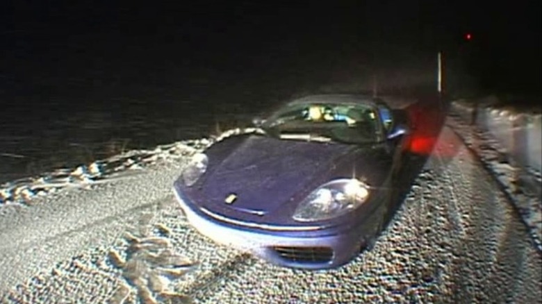 Ferrari driving on snowy road