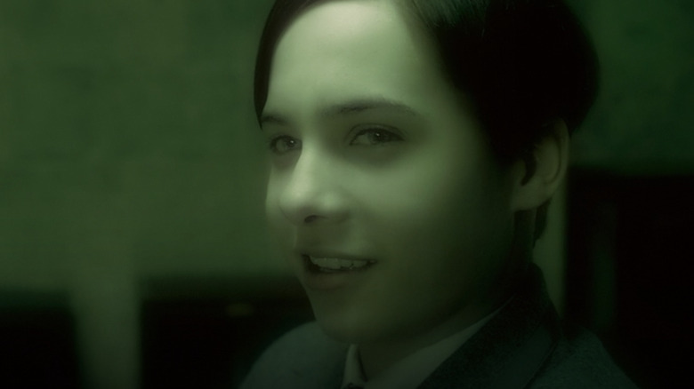 Young Tom Riddle smirks