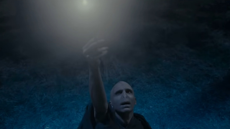 Voldemort holding Elder Wand aloft