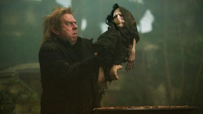 Wormtail holding baby Voldemort