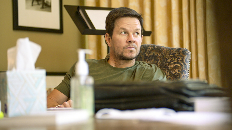 Wahlberg with hand soap and tissues in meeting