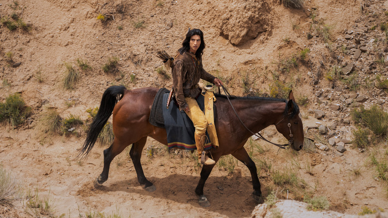 Calian riding a horse in Walker: Independence