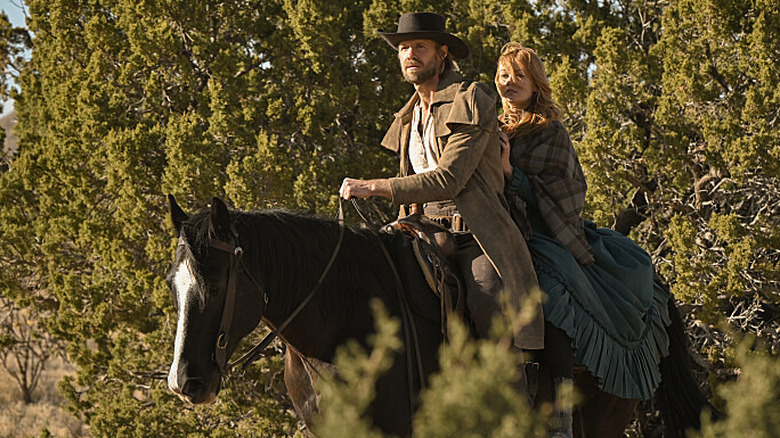 Abby and Rawlins riding a horse together on Walker: Independence