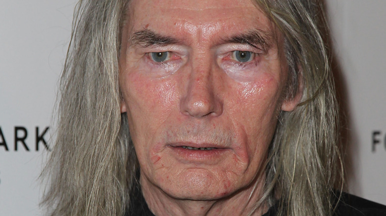 Billy Drago looks straight ahead