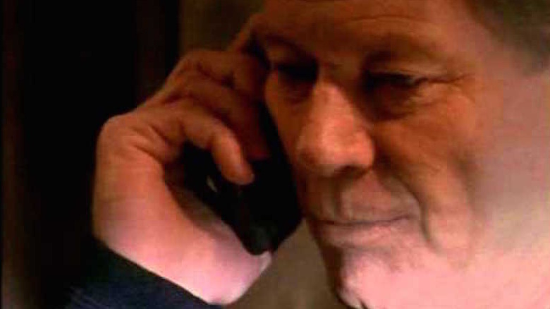 Michael Parks listens on a cell phone