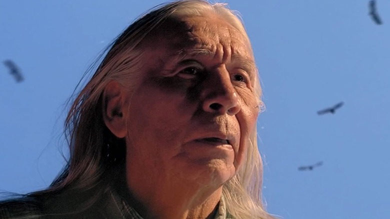 Floyd Red Crow Westerman looks into the distance