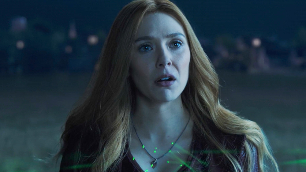 Wanda with green lasers pointed at her