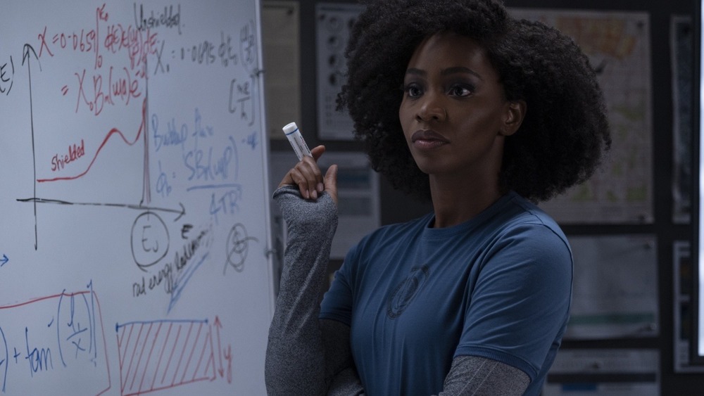 Monica Rambeau holding a marker