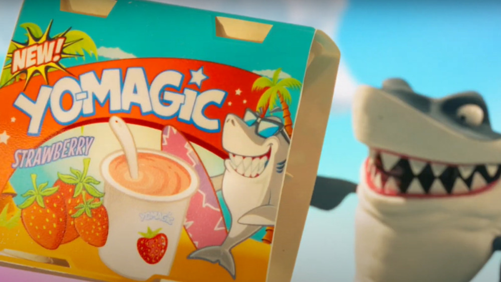 A shark holding a Yo-Magic box