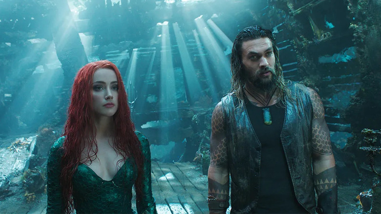 Mera and Arthur underwater looking forward listening