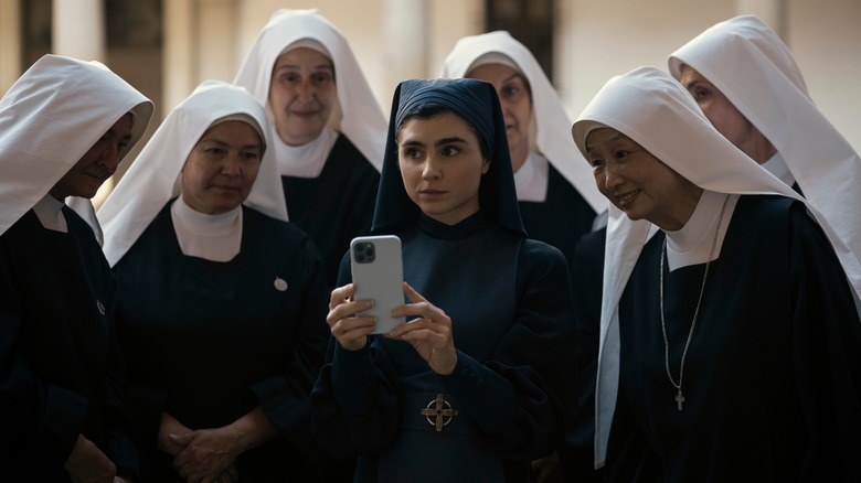 Nuns looking at a phone