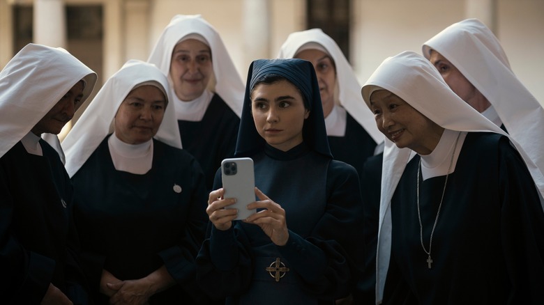 Ava Silva poses with nuns 