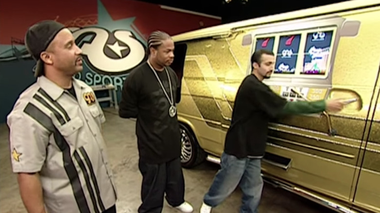 Xzibit stands next to a slot machine minivan