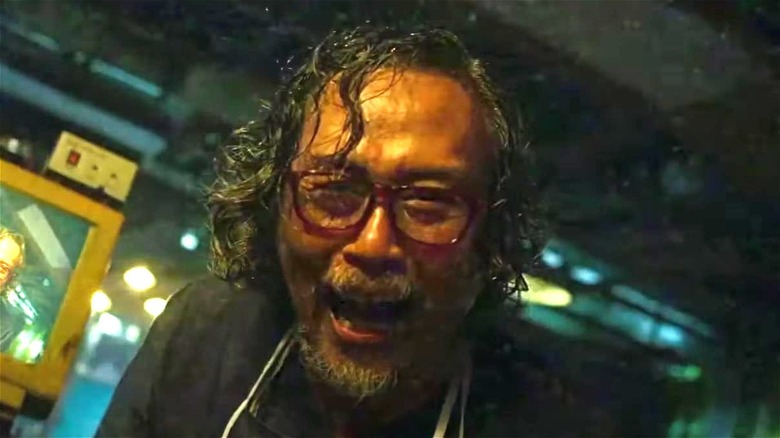 sweaty doctor with glasses laughing in V/H/S/94