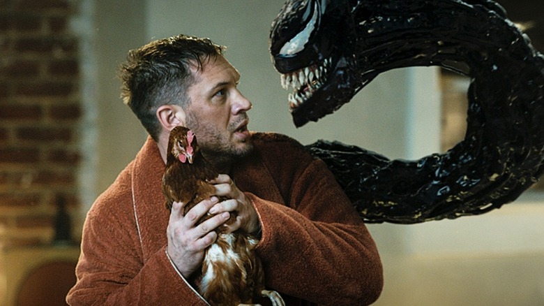 Eddie protecting a chicken from Venom