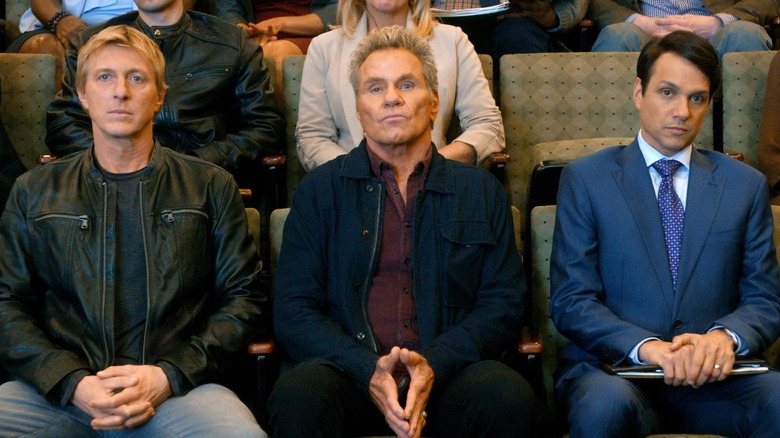 William Zabka, Martin Kove, and Ralph Macchio sitting in Cobra Kai Season 3