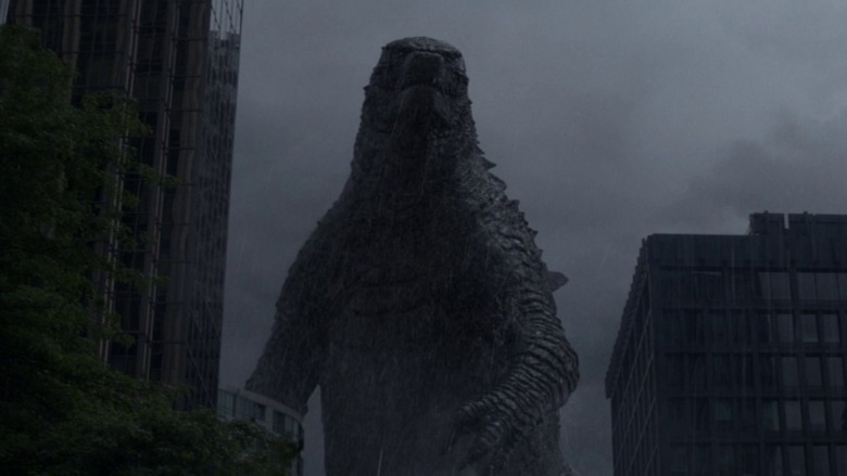 Godzilla walking through city