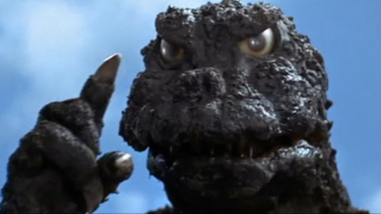 Godzilla wagging finger