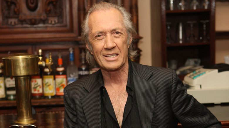 David Carradine posing at The Playwright Tavern in April 2009