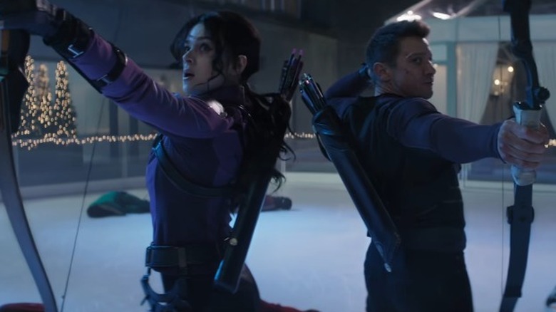 Kate Bishop and Clint Barton firing arrows