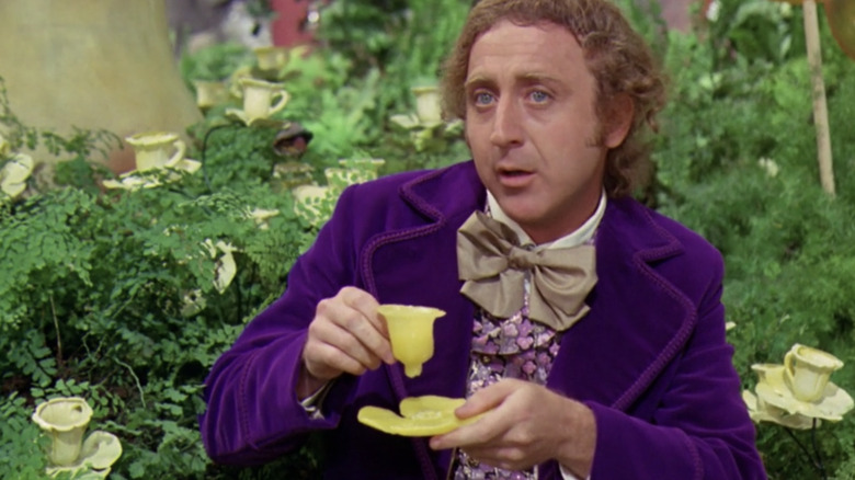 Willy Wonka holding wax teacup