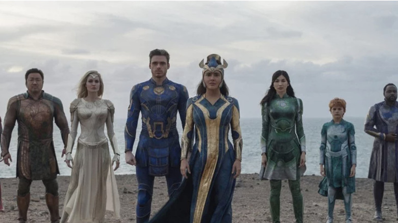 Eternals standing on beach