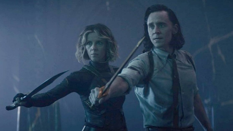 Loki and Sylvie holding swords