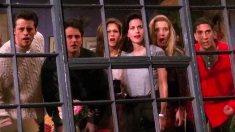 Friends cast looking out window