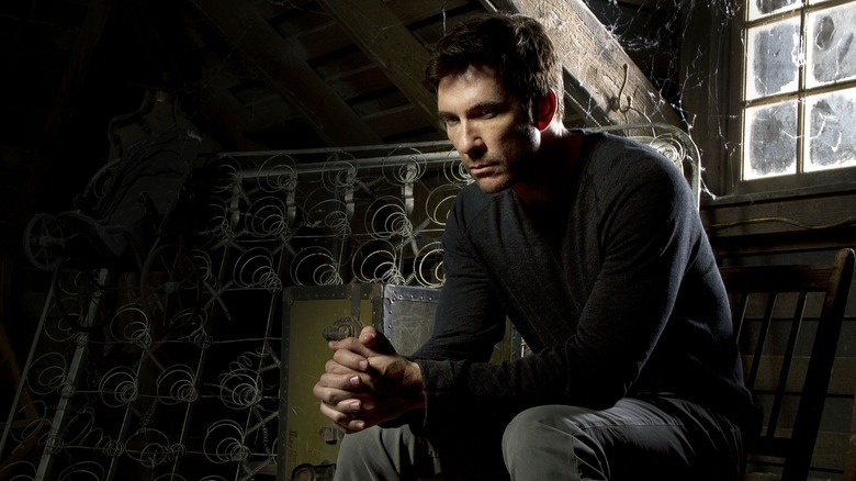 Dylan McDermott glowering