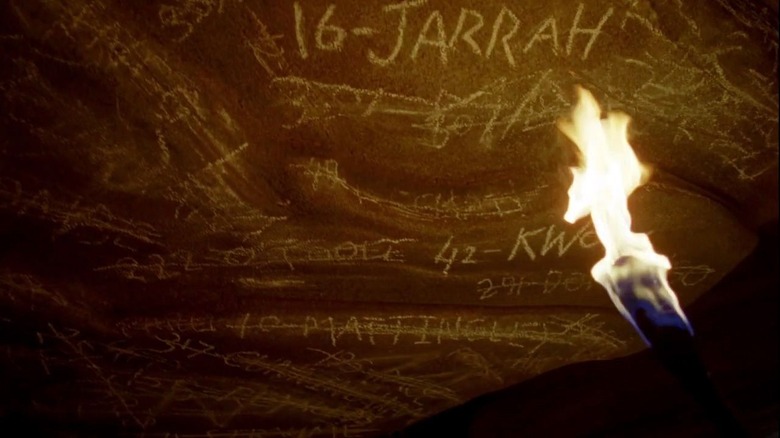 Names and numbers on wall in Lost