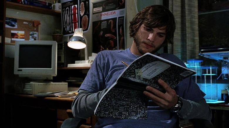 Evan sits in his room writing in a notebook in "The Butterfly Effect" (2004)