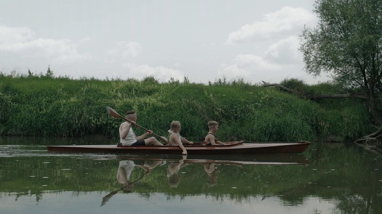 Rudolf Höss and two of his children in a canoe