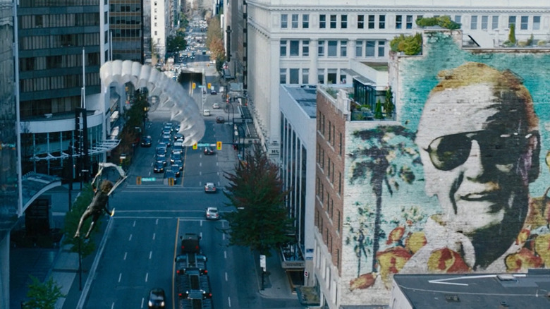 Domino parachuting past Stan Lee mural