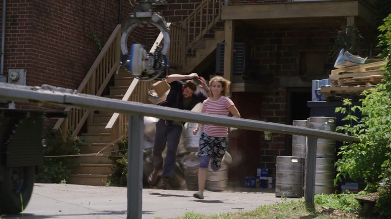 Krasinski and Simmonds running camera