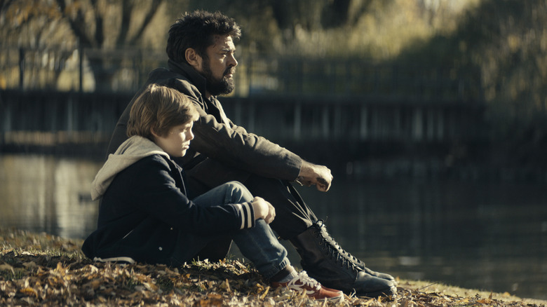 Butcher and Ryan sitting by lake