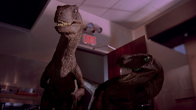 Velociraptors stalking in kitchen in Jurassic Park (1993)