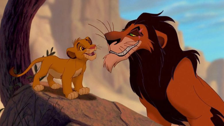 Simba stands on a rock and looks at Scar