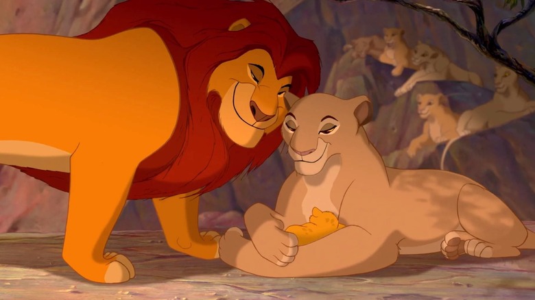 Mufasa and Sarabi look down at a baby Simba